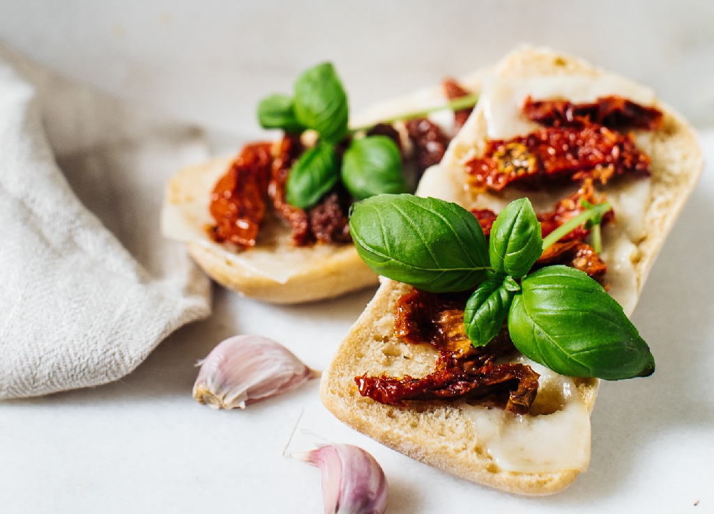 Toast with dried tomatoes and basil