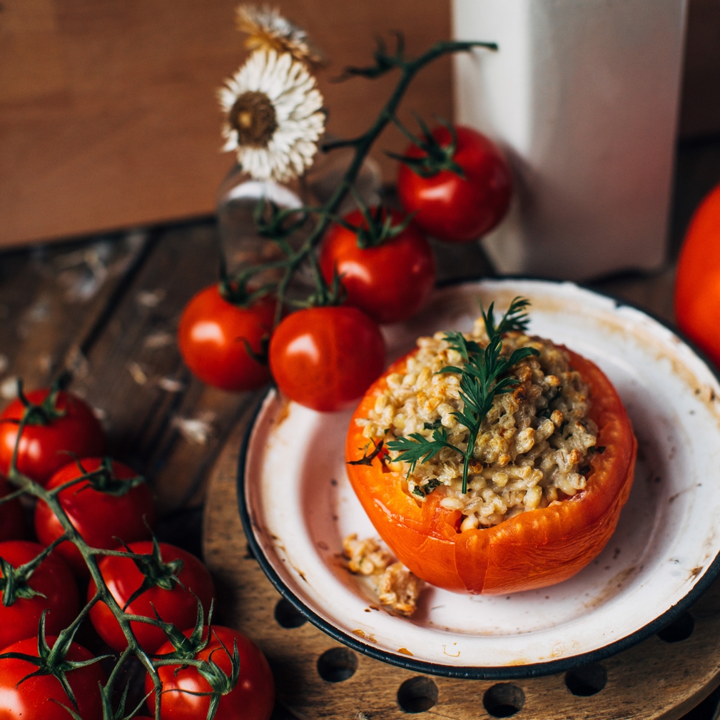 Roasted tomatoes stuffed with pearl barley and cheese